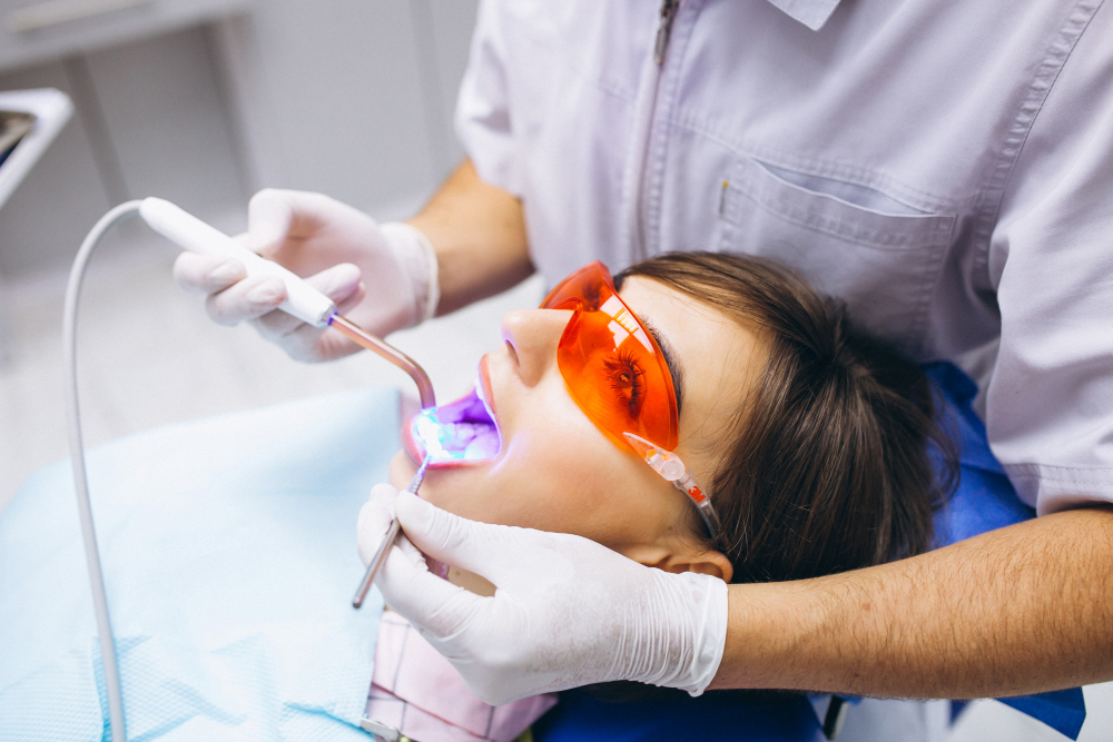 Dentist performing professional teeth cleaning at RK Dental Practice in Chandigarh.