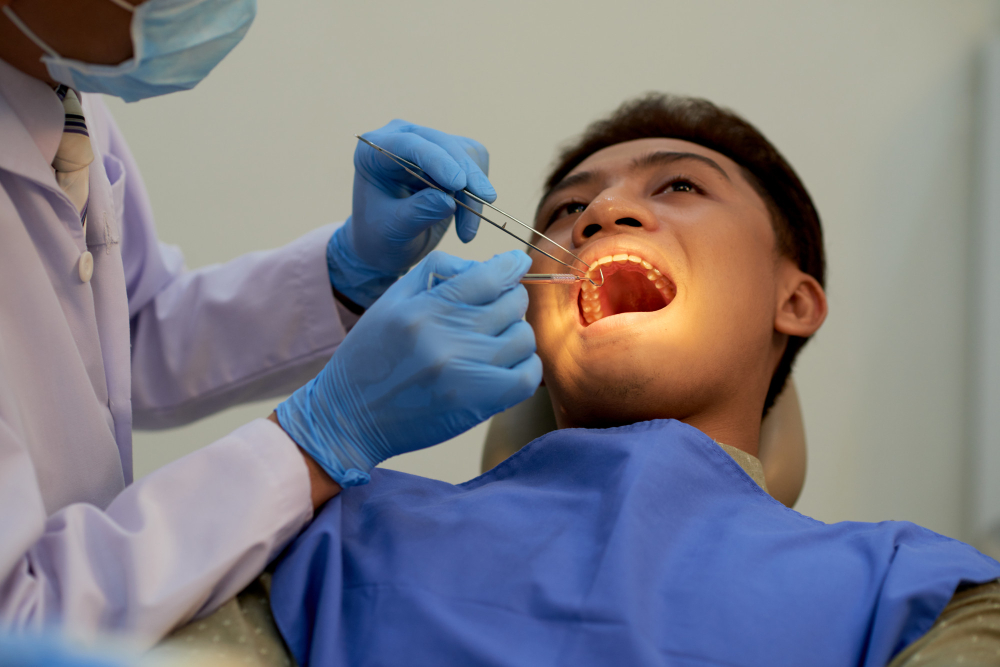 Dentist performing a tooth filling procedure to restore a damaged tooth in Chandigarh.